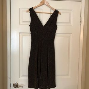 Black and gold cocktail dress.